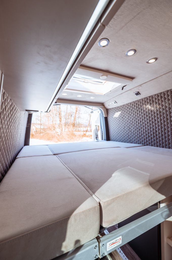 Interior; rear view; bed unfolded, rear doors open